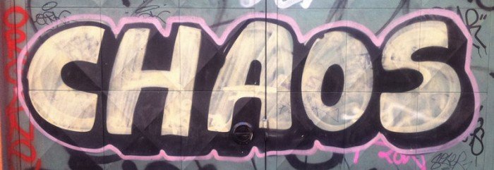 chaos-700x241-1 The word chaos graffitied onto a wall