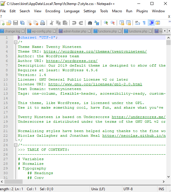 Showing the opened style.css file inside the Notepad ++ text editor application.
